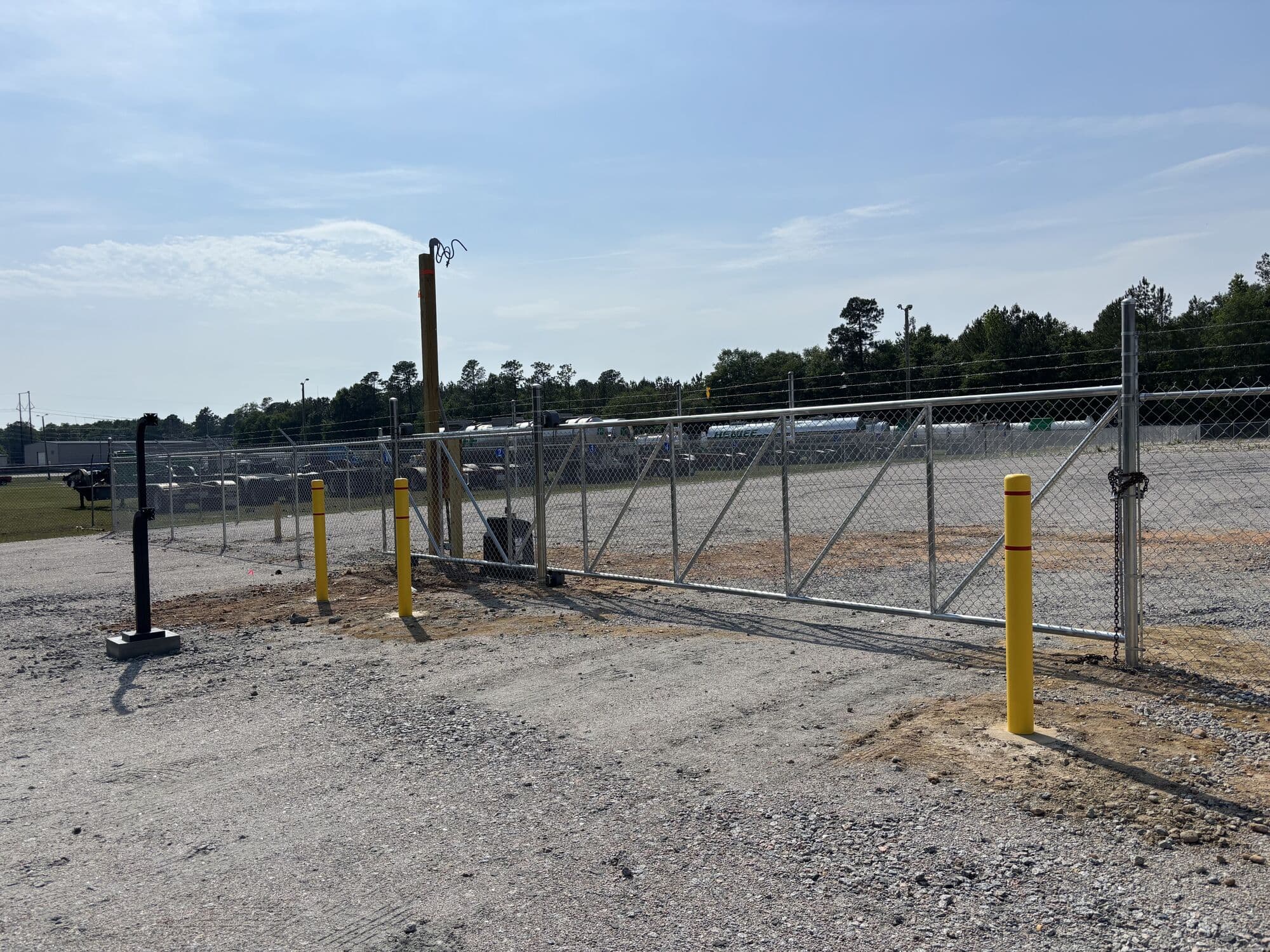 Sliding security gate with bollards at the entrance of Legacy Outdoor Storage