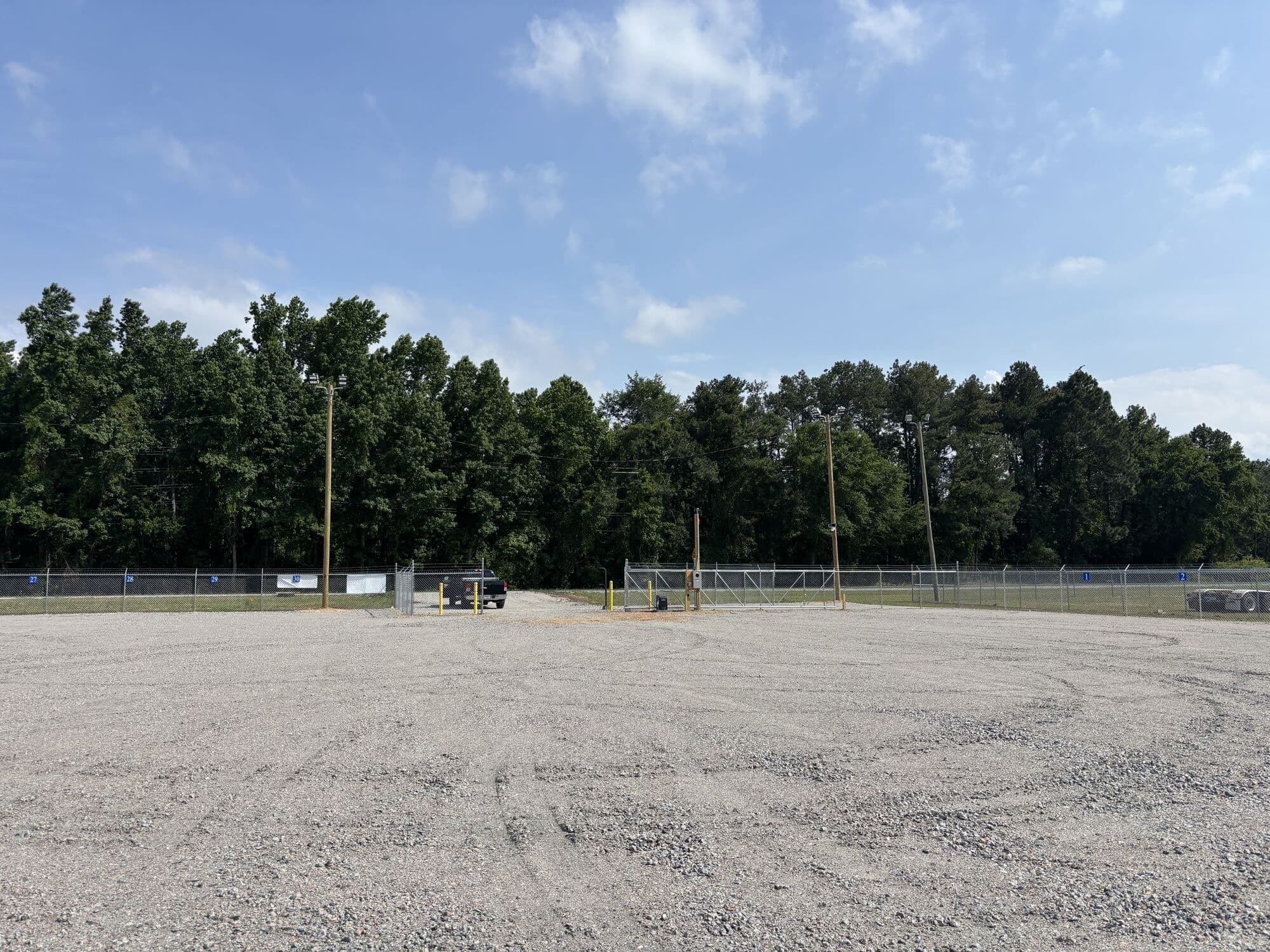 Wide gravel lot with room to maneuver large vehicles at Legacy Outdoor Storage